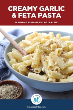 creamy garlic and feta pasta in a blue bowl