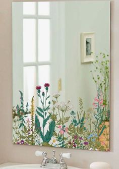 a bathroom sink sitting under a mirror next to a wall mounted faucet in front of a window