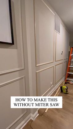 an empty room with white walls and wood flooring in the process of being painted