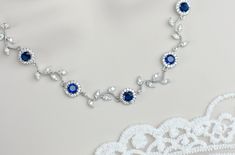 Blue Sapphire Bridal Necklace, Sapphire Bridal Necklace, Something Blue Wedding, Blue Sapphire CZ Round Connectors and Branch Tree Necklace Materials used: - rhodium plated over brass cubic zirconia branch tree connector - 9mm Blue Sapphire and white cubic zirconia round connectors - rhodium plated over brass chain - rhodium plated over brass lobster clasp and findings - rhodium plated over brass extension chain All metal Components are Hypoallergenic, High quality plated, Anti tarnish and have Long lasting color. The listing is for one necklace. ❤❤ ❤BRIDAL and BULK ORDERS DISCOUNT ❤ ❤❤  5% Discount : 2 items (Use Coupon Code - 5DISCOFF) 10% Discount : 3-5 items (Use Coupon Code - 10DISCOFF) 15% Discount : 6 items and more (Use Coupon Code - 15DISCOFF) Here is a helpful link how to use the Sapphire Necklace Wedding, Blue Wedding Necklace, Simple Bridal Necklace, Beach Wedding Necklace, Wedding Choker Necklace, Dnd Oc, Pearl Drop Pendant, Necklace Sapphire, Branch Tree