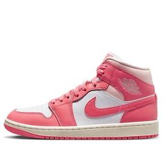 The Air Jordan 1 Mid 'Strawberries and Cream' is a stylish sneaker for adults. It features a white base, pink overlay, rubber outsole, and a creamy tongue and midsole. The sneaker is inspired by the classic Air Jordan 1 silhouette and is part of the Jordan 1 series. It is perfect for everyday wear and is sure to turn heads with its unique design. The sneaker is made from high-quality leather and is finished with a mesh tongue and lining. The 'Strawberries and Cream' colorway is a combination of Jordan 1 Strawberries And Cream, Strawberry And Cream Jordan 1, Nike Pink High-top Jordan Shoes, Air Jordan 1 Mid Hyper Pink, Air Jordan 1 Mid Gs Pinksicle, Mid Digital Pink Jordan, Retro Basketball Shoes, Sea Coral