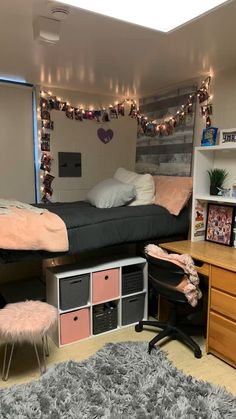 a dorm room with two beds, desk and shelves