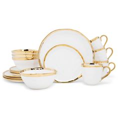 a white and gold dinner set