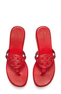 A cutout logo medallion offers signature charm atop a leather flip-flop lifted by a chunky platform and subtle wedge heel. 1 3/4" heel; 1" platform; 3/4" slope (size 8.5) Leather upper and lining/synthetic sole Imported Classic Sandals With Red Sole, Wedge Flip Flops, Leather Flip Flops, Tory Burch Miller, Chunky Platform, Platform Wedge, Thong Sandals, Platform Wedges, Flip Flop