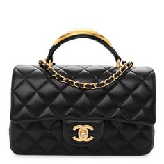 This is an authentic CHANEL Lambskin Quilted Metal Mini Top Handle Rectangular Flap in Black. This chic petite shoulder bag is crafted of diamond quilted lambskin leather in black. The crossbody bag features a top handle with metal detail, a long-aged gold chain-link leather threaded shoulder strap and a frontal flap with a Chanel CC turn lock. The flap opens to an interior of smooth black leather with zipper and patchpockets. Mini Top, Metal Detail, Overnight Bags, Navy Fashion, Makeup Bags, Diamond Quilt, Overnight Bag