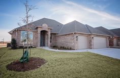 a house with a tree in the front yard