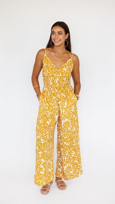 LIMITED RESTOCK CAPSULE. Stand out in this stunning jumpsuit, made to flow with buttery soft rayon and an exaggerated wide pant leg. Features adjustable straps and a gentle smocked waist to flatter. ** Our Model is 5'8" and wearing a size SMALL. ** Fabric and Care Instructions: *100% Rayon *Hand wash cold * Line Dry Chic Rayon Jumpsuits And Rompers For Spring, V-neck Jumpsuits And Rompers With Smocked Back For Vacation, Bohemian Spring Jumpsuits And Rompers With Elastic Waistband, Sleeveless Rayon Jumpsuits And Rompers For Spring, Bohemian Jumpsuits And Rompers With Elastic Waistband For Spring, Summer Brunch Jumpsuits And Rompers With Elastic Waistband, Summer Wide Leg Jumpsuits And Rompers For Vacation, Summer Wide-leg Jumpsuits And Rompers For Vacation, Summer Wide Leg Jumpsuits And Rompers With Elastic Waistband