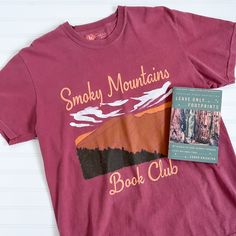 Let's go on an adventure to the National Parks! This bookish tee features an oversized design of the Smoky Mountains on a brick red Comfort Colors tee. It's so comfy, high quality & made to last with a soft, vintage look and feel! You will not want to take it off. Features 100% ring spun cotton Soft washed garment dyed fabric Tee runs slightly big and has a wide boxy throw-back 90s style cut For size guide, view comfort colors tee Pictured: I'm 5'5" & wearing a size large. Casual Red T-shirt For Outdoor Activities, Red Cotton Tops For Outdoor Activities, Comfort Colors Tee, 90s Style, Brick Red, Smoky Mountains, Dyed Fabric, Sweater Vest, Vintage Look