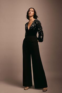 Style: JumpsuitFabric: VelvetLength: RegularNeckline: V NeckSleeve Length: Long Sleeve Prom Jumpsuits Women, Black Tie Black Women, Party Jumpsuits For Women, Diwali Party Outfit, Black Tie Jumpsuit, Party Wear Jumpsuit, Long Jumpsuit Outfit, Jazz Bar Outfit, Formal Party Outfit