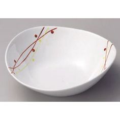 a white bowl with red and yellow designs on it