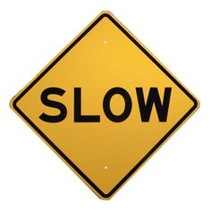 a yellow slow sign with the word slow written on it in black letters, against a white background