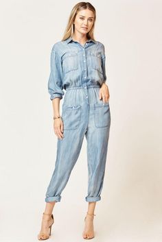 An effortless pull-on jumpsuit, finished with a basic collar, front pockets, and an elastic waist detail. it's a laid-back way to do pretty. Machine wash cold, hang to dry. Runs true to size. Classy Jumpsuits For Weddings, Jumpsuits For Ladies, Jumpsuit Palazzo, Denim Jumpsuit Outfit, Summer Jumpsuits, Jumpsuit Pattern Sewing, Denim Jumpsuits, Classy Jumpsuit, Denim Playsuit