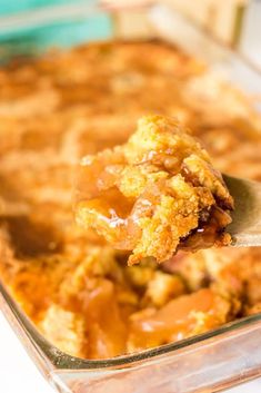 a spoon full of food in a casserole dish