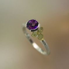 amethyst ring with tiny cast gold hydrangea blossom, so sweet and delicate. Elegant Purple Amethyst Birthstone Ring, Delicate Amethyst Ring As Gift, Exquisite Amethyst Ring For Anniversary, Exquisite Amethyst Ring, Elegant Purple Amethyst Ring For Gift, Elegant Amethyst Ring For A Gift, Elegant Solitaire Amethyst Jewelry, Elegant Amethyst Ring With Bezel Setting As Gift, Flower Shaped Amethyst Jewelry For Anniversary