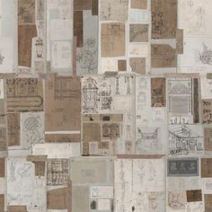 a wall covered with lots of different types of papers and drawings on it's sides