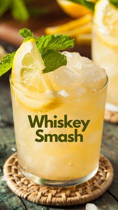 the whiskey smash cocktail is garnished with lemon and mint