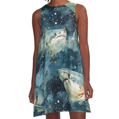 a woman wearing a dress with an image of two dolphins in space on the side