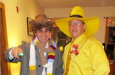 two men dressed up in yellow hats and scarves