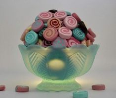 a glass bowl filled with lots of candy