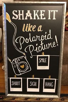 a sign that says, shake it like a polaroid picie smile shoot hang