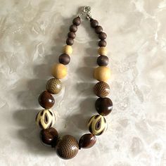 Nwot Wooden Beads From Nyc Approx 15” In Parameter Shiny Beads In Front, Dull Beads In Back Earth Tone Colors/ Shades Of Brown Brown Necklaces With Colorful Round Beads, Brown Faceted Bead Necklaces, Brown Faceted Round Bead Necklaces, Brown Round Necklaces With Colorful Beads, Brown Necklaces With Colorful Beads, Elegant Brown Beaded Necklace With Large Beads, Brown Round Beaded Necklace With Large Beads, Brown Beaded Necklace With Large Round Beads, Brown Beaded Necklaces