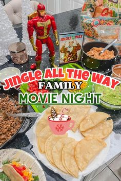 a table full of food with the words, single all the way family movie night