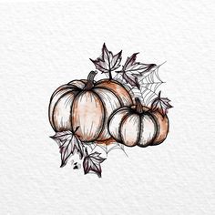 three pumpkins with leaves on top of them