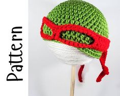 a crocheted hat on top of a wooden stick