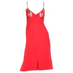 This stunning vintage Valentino red slip dress is in a beautiful, luxe silk crepe with a lace bustline and spaghetti straps. The dress is fully lined below the bust and we especially love the cutouts at the hemline that have lace inserts underneath. Please look at the measurements carefully because this dress fits more like a modern day US size 4 or a size 6 with narrow hips. The lace bra portion snaps in the back and there is a zipper that starts at the waist. The back of the dress has a unique Runway Gowns, Slip Dress With Lace, Vintage Red Dress, Black Velvet Skirt, Evening Mini Dresses, Red Slip Dress, Valentino Red, Long Slip Dress, Vintage Valentino