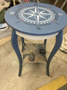 a small table with a compass design on it