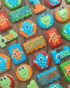 decorated cookies are arranged on a table for children's birthdays and special occasions