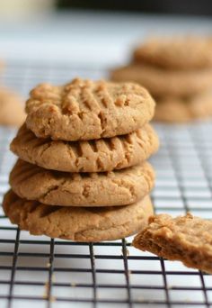 a stack of cookies sitting on top of a cooling rack