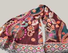 Amazing handmade embroiderd shawl. Colorful woolen indian scarf. + Unique and exclusive embroidered shawl for a ceremony, wedding or party. +` Fully embroidered by hand with a floral design and in very bright colors' + Great accessory to any dress and occasion.  + Fabric:           100% wool Size:               70cm x 200cm // 27,3" x 78" Dry clean + Note that the colors of the original product may vary slightly from those you see on the computer screen. For any questions you may have contact wi Bohemian Red Pashmina Shawl With Motifs, Red Bohemian Shawl With Motifs, Bohemian Brown Shawl Dupatta, Bohemian Style Multicolor Pashmina Shawl, Multicolor Pashmina Shawl In Bohemian Style, Bohemian Shawl With Woven Motifs For Winter, Winter Bohemian Shawl With Woven Motifs, Winter Pashmina Shawl With Motifs, Bohemian Multicolor Embroidered Pashmina Shawl With Traditional Patterns