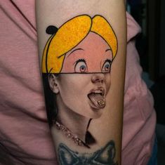 a woman's face has been painted on the arm