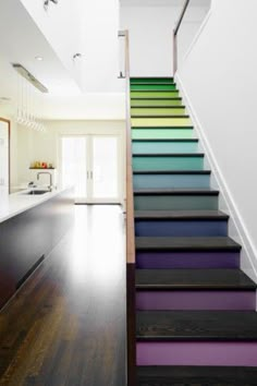 an empty room with stairs leading up to the second floor