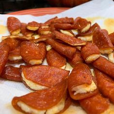 there are many pieces of food on the paper towel that is cut up and ready to be eaten