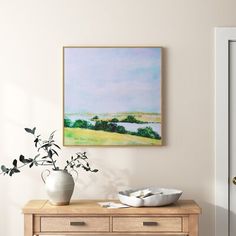 a painting hanging on the wall above a dresser