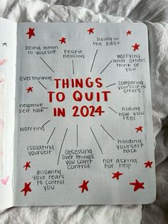 an open notebook with things to out in 2014 written on the pages and red stars