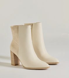 A stylish staple bootie to pull your look together! The bootie features a mixed faux suede and faux leather material, a pointy toe, a tall stacked block heel, and an inner zipper closure. Complete with your favorite cardigan and high waist jeans. Fit & Features3.5” Block heel, 5" leg opening, 3" shaft height50/50 faux suede and faux leather materialAnkle-fitPointy toe Inner zipper closureRuns true to size Beige Faux Leather Heeled Boots For Fall, White Suede Boots For Fall, Beige Faux Leather Boots For Work, Cream Faux Leather Boots Medium Width, Cream Faux Leather Boots For Winter, Cream Boots For Winter Workwear, Cream Winter Boots For Workwear, Cream Medium Width Faux Leather Boots, Winter Cream Faux Leather Boots