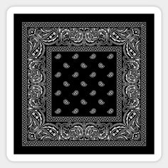 a black and white bandanna with paisley designs on it's edges, in the shape of a square