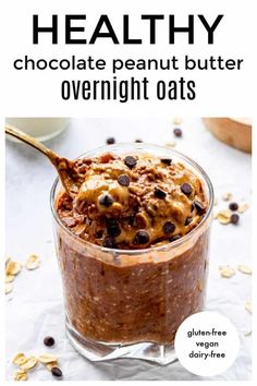 healthy chocolate peanut butter overnight oats in a glass jar with a spoon on top