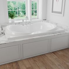 a large white bath tub sitting next to two windows