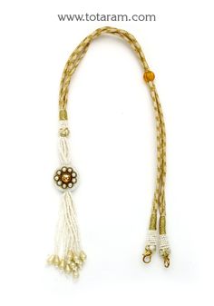 back splash - latkan dori with white beads - tassel for necklaces
  now show off not just your necklace but your back too .. back splash
  length of the dori is adjustable upto : 24.00 inches
  this item is not made of gold
  this item does not have any gold in it.
  use this dori - tassel to attach it to any necklace.

introducing the stunning back splash - latkan dori with beads - tassel for necklaces, brought to you by totaram jewelers. elevate your style and make a statement not just with yo 22k Gold Jewelry, Gold Jewelry Indian, Beaded Tassels, Gifts For Adults, Online Jewelry Store, White Beads, 22k Gold, Your Back, Show Off