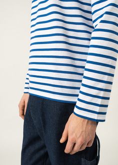 Light and versatile, the Breton striped shirt or marinière MINQUIERS MODERNE embodies a French state of mind. Its masculine straight fit around the waist and down the hips with full-length sleeves make it suitable for both men and women looking for a boyfriend fit. Please refer to the sizing guide to identify your best fit. Fashion tip: when wearing their beloved MINQUIERS MODERNE, many women like to roll up their sleeves as they are longer than average. Perfect to bring in some French girl effo White Marine Style Cotton Tops, White Sailor Style Long Sleeve Tops, White Marine Style Long Sleeve Top, Marine Style Long Sleeve Cotton Tops, Sailor Style Striped Long Sleeve Top, Striped Sailor Long Sleeve Top, Blue Horizontal Stripe Long Sleeve Top, Sailor Striped Long Sleeve Top, Blue Striped Long Sleeve Top