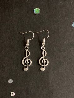 Pair of handmade silver treble clef earrings.  These earrings are made from silver colour treble clef charms and silver colour hook fastenings. The drop measures 4.5cm and they are 1cm wide. They are hand made by me. These earrings are a great gift, especially for someone who loves music. All purchases of jewellery or hair accessories come with a free lilac organza gift bag! I currently only post within the UK, Canada, USA and the European Union. Postage for additional items purchased in the sam Silver Nickel-free Music-themed Earrings, Music-themed Silver Earrings, Music Earrings, October Jewelry, Rabbit Earrings, Musical Gift, Original Necklace, Music Accessories, Treble Clef