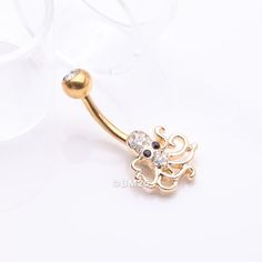 Shine like the ocean with our Golden Evil Octopus Sparkle Belly Button Ring. This elegant piece features a striking golden octopus design adorned with sparkling jewels. Make a bold statement with this unique and eye-catching belly button ring. * Material: 316L Stainless Steel Gold Plated * Bar Size: 14 GA (1.6mm), 10mm (3/8") * Length: 1 inch (26mm) * Width: 0.5 inch (12mm) Suitable for * Navel Piercings It is always recommended to know your exact piercing size to ensure fitment, safety, and com Evil Octopus, Heavy Sweating, Octopus Design, Navel Piercing, Belly Button Ring, Button Ring, Belly Rings, Belly Button, Black Rings