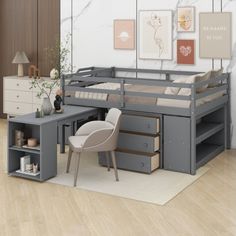 a loft bed with desk underneath it in a room that has wood floors and white walls