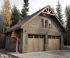 a two car garage is shown in front of some trees