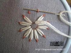 a close up of a piece of cloth with flowers on it and wires attached to the fabric