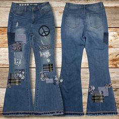 These one-of-a-kind patchwork bell bottom jeans embody the free-spirited essence of boho style. Crafted from distressed blue denim, they feature an eclectic mix of patches of peace and love. The iconic bell bottom silhouette nods to 70s fashion, while the modern S.O.N.G. Fit n Flare cut ensures a flattering fit for today's woman. Sized at Women's 13/31, these jeans offer both comfort and statement-making flair. The distressed details add vintage charm, making each pair truly unique. A standout f Spring Denim Blue Patchwork Flare Jeans, Spring Patchwork Medium Wash Flare Jeans, Patchwork Flare Jeans Medium Wash For Spring, Denim Blue Patchwork Flare Jeans For Spring, Denim Blue Flare Jeans With Patchwork For Spring, Spring Patchwork Flare Jeans In Medium Wash, Spring Patchwork Flare Jeans, Spring Cotton Flare Jeans With Patchwork, Summer Patchwork Denim Flare Jeans